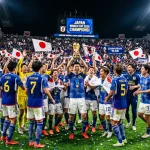 Japanese national team in blue jerseys celebrating World Cup victory