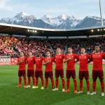 Swiss national team in red jerseys lined up before international match